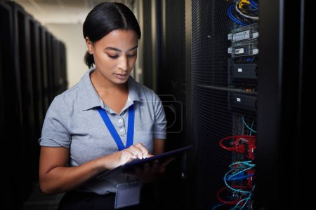 Woman, tablet and server room, programming or coding for cybersecurity, information technology or data protection backup. Engineering person on digital software, hardware inspection or basement check.