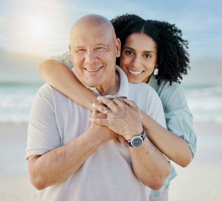Photo for Beach, portrait and woman with her senior father on a family vacation, holiday or adventure. Happy, smile and young female person embracing her elderly dad with love by the ocean on a weekend trip. - Royalty Free Image