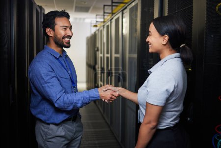 Photo for Handshake, partnership or happy people in server room of data center for network help with IT support. B2b deal agreement, teamwork or engineers shaking hands together in collaboration for solution. - Royalty Free Image