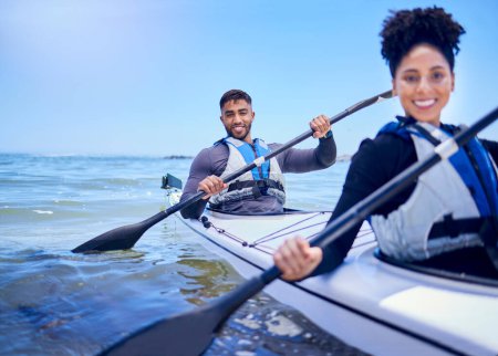 Photo for Water, man and woman in kayak at lake, beach or river for exercise in sports at sea in portrait. Ocean holiday, adventure and fitness, happy couple with smile rowing in canoe at training or challenge. - Royalty Free Image