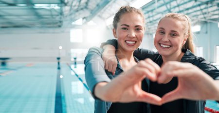 Photo for Happy woman, swimming and heart hands in support, teamwork or care in sport fitness together at pool. Female person or professional swimmer with loving emoji, shape or symbol in team exercise or goal. - Royalty Free Image