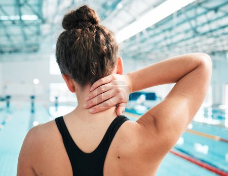 Photo for Sports injury, neck pain and fitness with woman at swimming pool for medical, training and health. First aid, emergency and accident with person and problem for muscle ache, inflammation and wellness. - Royalty Free Image