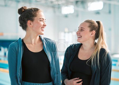 Photo for Fitness, sports and woman swimmer friends by a pool in the gym together for health, training or exercise. Teamwork, wellness and smile with happy young female athletes at an indoor swimming center. - Royalty Free Image