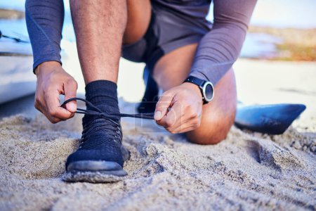 Photo for Hands tie shoes, ocean and athlete start workout, training and kayak exercise outdoor. Sand, person and tying sneakers at beach to prepare for fitness, sports and healthy body for wellness in summer - Royalty Free Image