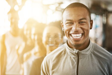 Photo for Fitness, black man and portrait with team, workout class and training in a health and wellness club. Lens flare, happy and smile with diversity and personal trainer with exercise, sports and group. - Royalty Free Image