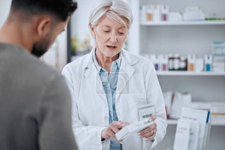 Photo for Senior woman, pharmacist and customer in consultation for medication or prescription at drugstore. Mature female person, medical or healthcare employee with patient and pharmaceuticals at pharmacy. - Royalty Free Image