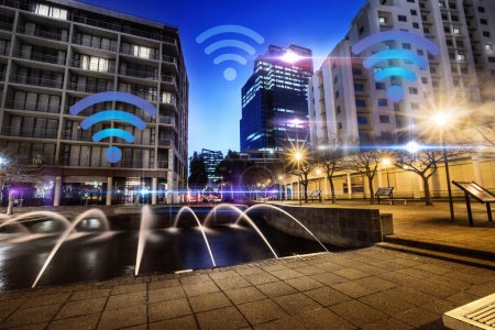 Photo for Network, city and wireless internet at night with neon overlay, lights and connection for communication. Cityscape, future technology and icon for location, streaming and connectivity in Cape Town. - Royalty Free Image