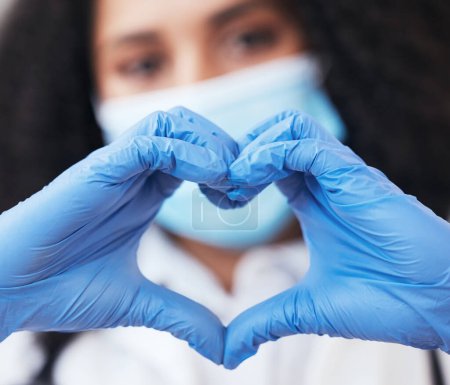 Photo for Healthcare, hands and doctor with emoji heart at a hospital for support, hope or thank you for organ or blood donation. Zoom, love and female nurse with finger frame for gratitude in medical research. - Royalty Free Image