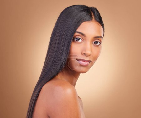 Photo for Portrait, hair care and woman with cosmetics, natural beauty and wellness on a brown studio background. Face, person and model with shine, aesthetic and glow with dermatology, texture and volume. - Royalty Free Image