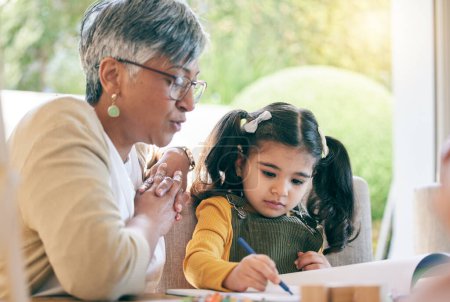Photo for Teaching, grandma or girl learning drawing in book for creative skills or growth development. Senior, support or mature grandmother helping an artistic child to color in a school project or homework. - Royalty Free Image