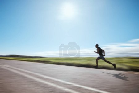 Photo for Runner blur, fast and man on road outdoor, cardio or healthy body fitness. Athlete speed, sprint or exercise in competition, workout training or race on street in wellness at countryside mockup space. - Royalty Free Image