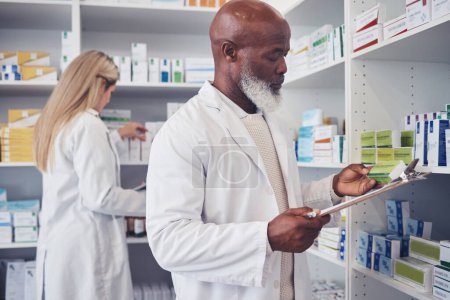 Photo for Pharmacy product, clipboard and mature black man reading medicine label, prescription information or search shop shelf. Hospital inventory, box and African healthcare expert check stock checklist. - Royalty Free Image