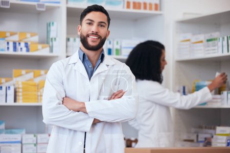 Photo for Medicine, pharmacy and portrait of healthcare man at shelf with pills, stock or medication. Pharmacist person or medical staff with arms crossed and smile at pharmaceutical, drugstore or retail shop. - Royalty Free Image