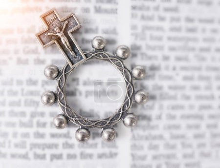 Photo for Rosary, open book or bible study for faith, studying religion or mindfulness with holy spiritual scripture. Christian literature, background or story for education or knowledge on God or Jesus Christ. - Royalty Free Image
