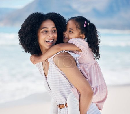 Photo for Happy, piggyback and mother with child at the beach on a family vacation, adventure or holiday. Smile, love and young mom carrying, playing and bonding with her girl kid by the ocean on weekend trip - Royalty Free Image