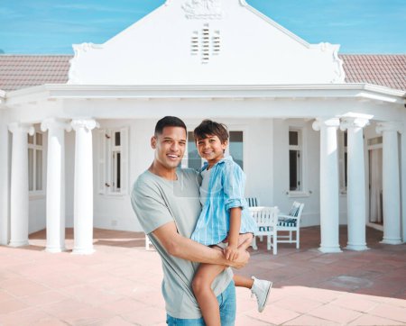 Photo for Happy, new home and portrait of father and child standing outdoor of their property or real estate. Smile, love and young dad with his boy kid standing outdoor building or modern house in backyard - Royalty Free Image