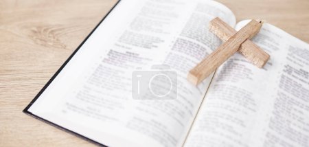 Photo for Bible, cross and religion, Christian faith and God with worship, studying scripture and closeup. Jesus Christ, prayer and spiritual, holy book and praise with belief, healing and gospel with guidance. - Royalty Free Image
