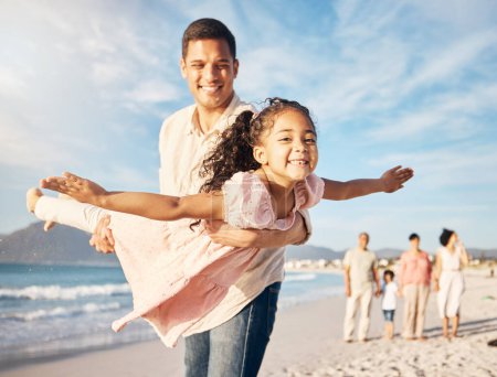 Photo for Smile, beach and father doing airplane with girl having fun on family vacation or holiday. Happy, travel and young dad playing and bonding with child by ocean on adventure or weekend trip together - Royalty Free Image