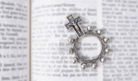 Photo for Rosary, open book or bible study for worship, religion or mindfulness with holy spiritual scripture. Christian literature, background or history education or knowkedge guide on God or Jesus Christ. - Royalty Free Image