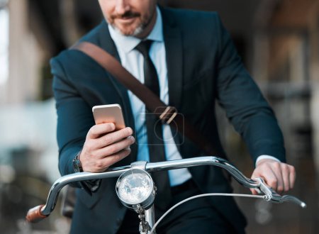 Photo for Businessman, phone in hands and bicycle outdoor for communication, travel and transportation. Entrepreneur person with a bike and smartphone for internet connection, carbon footprint and journey. - Royalty Free Image