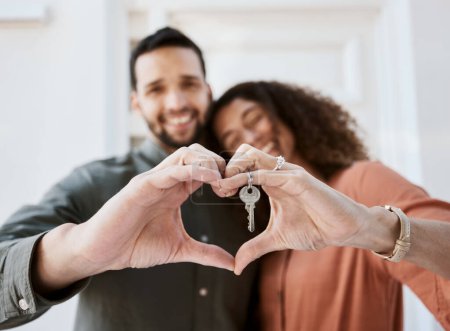 Photo for Keys, heart and hands by couple hug for real estate, success or mortgage loan in new home together. Love, emoji and man with woman smile for thank you, emoji or realtor, property or dream house sale. - Royalty Free Image