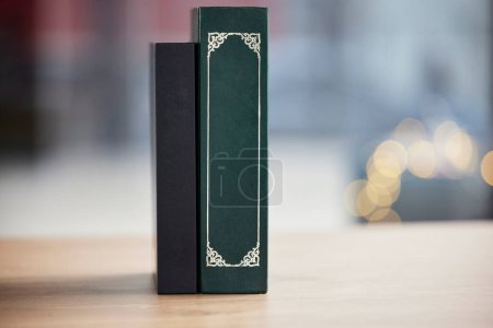 Photo for Books on table, mockup space and bokeh for religion, reading and study in faith education. Holy bible, desk and spiritual for learning, gospel knowledge and information to worship on a background. - Royalty Free Image