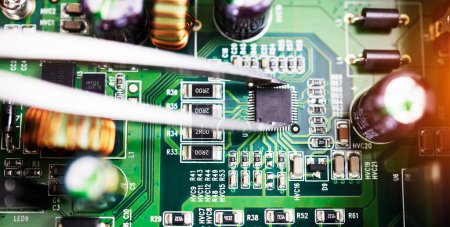 Photo for Motherboard, microchip closeup and engineering tweezer with electric maintenance of circuit board. Developer, IT and dashboard for electrical hardware update and technician tools for technology. - Royalty Free Image