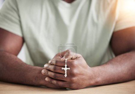 Photo for Crucifix cross, man hands and prayer beads in home with faith, christian praise and religion. Praying, necklace and worship in house with hope, gratitude and spiritual guide for support and healing. - Royalty Free Image