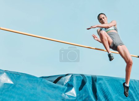 Photo for High jump, woman and sport with exercise, cardio and athlete in competition outdoor. Jumping, workout and training for performance with action, energy and contest with female person and mockup space. - Royalty Free Image