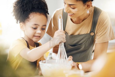 Photo for Boy, mom and baking in kitchen, teaching and learning with support, child development and breakfast. Home, cooking and kid chef helping happy mother, mixing bowl for milk and eggs recipe in morning - Royalty Free Image