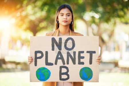 Photo for Woman, poster and save planet sign at park for climate change, environment and green eco friendly protest. Young person in portrait and nature, earth or globe support for sustainable world and action. - Royalty Free Image