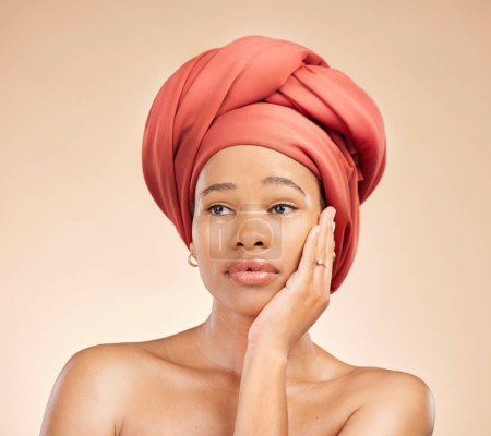 Photo for Thinking, beauty and black woman in studio with hair scarf, idea or natural cosmetic questions on brown background. Face, skincare and African lady model with head wrap, wellness or glow treatment. - Royalty Free Image