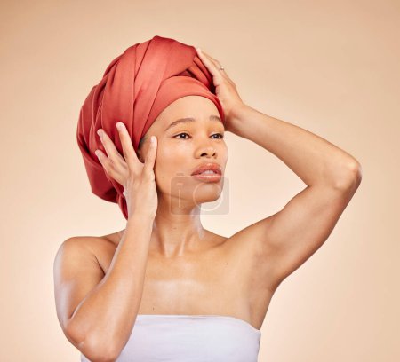 Photo for Hair, scarf and black woman in studio for wellness, beauty or natural cosmetics on brown background. Headwrap, pride and African lady model with glowing or skincare satisfaction, results or treatment. - Royalty Free Image