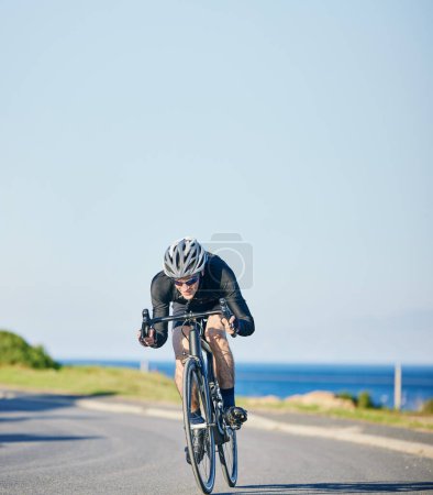 Photo for Speed, fitness and cyclist on bicycle on road in mountain with blue sky, exercise adventure trail and speed. Cycling race, nature and man with bike for fast workout, training motivation or energy - Royalty Free Image