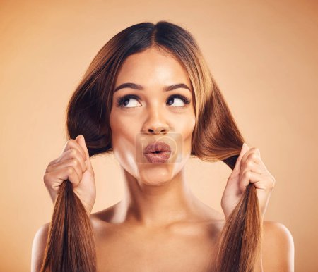 Photo for Face pucker, beauty or woman with hair care, healthy shine and strong extensions, volume or keratin results. Hairdressing, facial expression or natural model with studio hairstyle on brown background. - Royalty Free Image