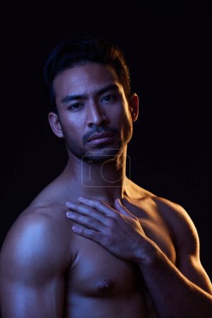 Photo for Topless, dark portrait and sexy man on black background in fitness inspiration, beauty aesthetic or bodybuilder fantasy. Healthy, strong body and male model with muscle, studio and neon lighting. - Royalty Free Image