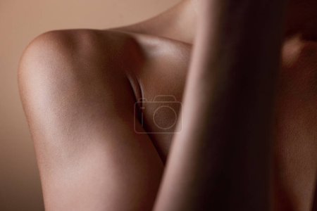 Photo for Healthy, skin and body closeup on woman, shoulder or natural glow and skincare texture in studio with cosmetics. Beauty, self care and arm of female model with clean, hygiene and aesthetic wellness. - Royalty Free Image