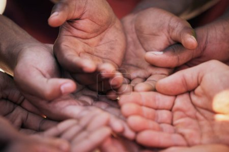 Hands, palm and diversity of people in circle for charity, ngo and support in poor community together from above. Helping hand, donation and empathy for children in poverty, society and crowdfunding.