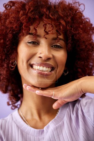 Photo for Happy, selfie and hand on face of black woman with confidence in profile picture for social media, blog or post. African, portrait or happiness with natural beauty or cosmetics on purple background. - Royalty Free Image