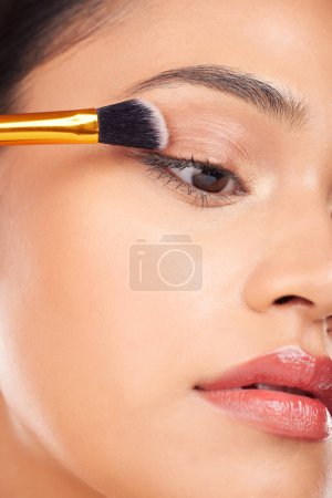Photo for Face makeup, eyeshadow brush and woman with studio cosmetics tools, beauty care product and closeup facial cosmetology. Foundation application, spa salon dermatology and aesthetic skincare model. - Royalty Free Image