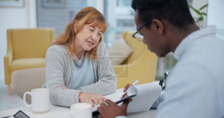 Photo for Talking, results and woman with black man or doctor for healthcare, insurance or checklist. Wellness, consulting and a senior patient speaking to an African clinic worker with a document for surgery. - Royalty Free Image