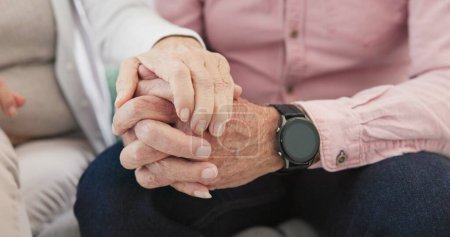 Photo for Closeup of old couple, man and woman holding hands for love, care and trust in retirement. Senior partner, loyalty and helping hand for kindness, sorry and support to forgive, hope or empathy at home. - Royalty Free Image