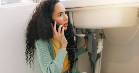 Photo for Sink repair, plumbing and woman on a phone call for maintenance, plumber service and home construction. Communication, manual labour and girl calling handyman for faucet problem, leak or kitchen pipe. - Royalty Free Image