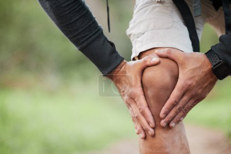 Photo for Knee pain, injury and person hand outdoor with fitness, workout and training accident from hike. Runner, leg massage and fail from trekking in the woods on a trail with muscle strain and emergency. - Royalty Free Image