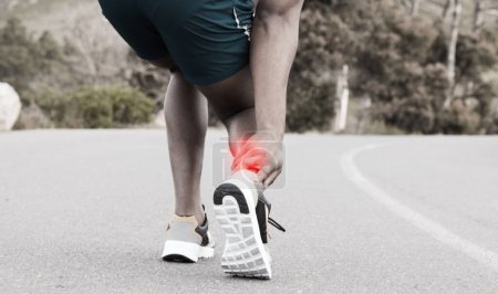 Photo for Fitness, injury or runner with ankle pain on road to exercise legs in training or outdoor cardio workout. Red glow, emergency or injured sports athlete suffering from broken foot after running a race. - Royalty Free Image