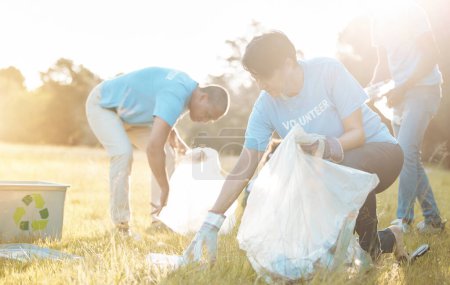 Photo for Nature recycling, community service volunteer and woman cleaning garbage, grass field trash or plastic pollution. Earth Day cooperation, eco project and charity team help with product clean up. - Royalty Free Image
