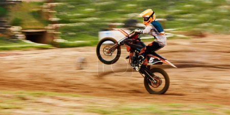 Photo for Motorcycle, balance and motion blur with a man at a race on space in the forest for dirt biking. Bike, fitness and power with a sports person driving fast on an off road course for freedom or speed. - Royalty Free Image
