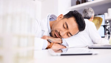 Photo for Asian man, scientist and sleeping on desk in laboratory, burnout or overworked in mental health. Tired male person, medical or healthcare worker asleep in lab rest, dreaming or fatigue at workplace. - Royalty Free Image