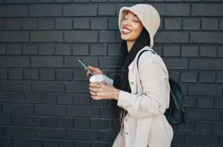 Photo for Happy woman with phone, brick wall and urban fashion, typing social media, chat and laughing. Streetwear, gen z girl or online influencer with smartphone for content creation and meme communication - Royalty Free Image