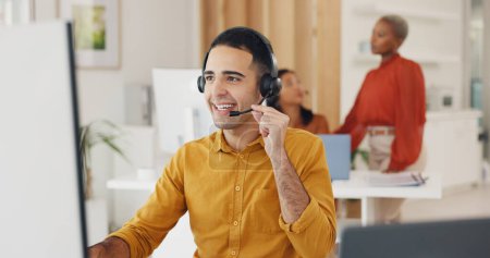 Photo for Call center, man and communication at computer in office for CRM questions, FAQ contact and IT support. Happy telemarketing agent at desktop for sales advisory, telecom solution and consulting client. - Royalty Free Image